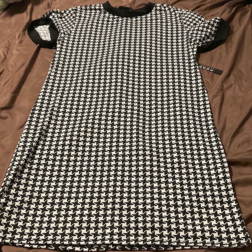 A black and white never worn Poof New York dress
